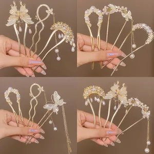 Elegant U-shaped hair fork set with pearls, butterfly charms, and golden tassels