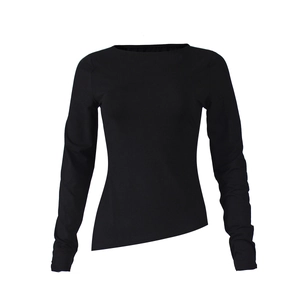 Detail of black long sleeve top showing asymmetric hem and modern pleated knit design