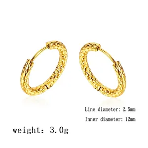 Detail of 12mm gold earrings with honeycomb texture showing 2.5mm wire diameter
