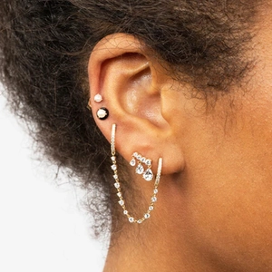 Elegant gold-tone earring set featuring chain link drops and cubic zirconia pear studs