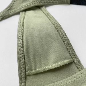 Grass green ribbed cotton thong featuring detailed knit texture and reinforced stitching