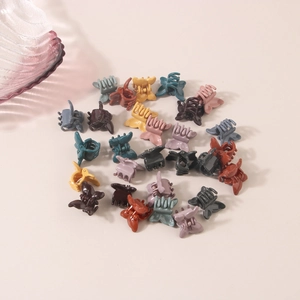 Mini colorful butterfly hair claws set for cute styling and hairstyles in pastel tones