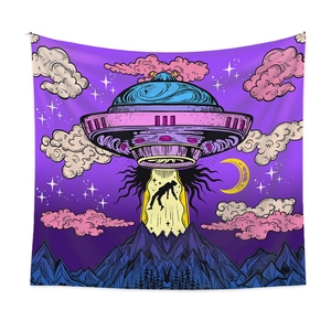 Macro detail of polyester tapestry showing UFO abduction art and forest silhouettes