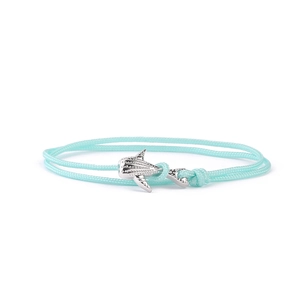 Light blue Milan cord bracelet with a textured silver-toned manta ray metal pendant