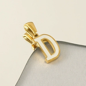 Minimalist gold-plated letter D pendant necklace with white enamel finish on reflective surface