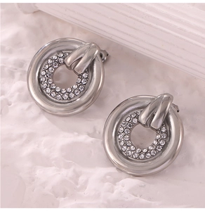 Detail of silver double layered ring earrings with shimmering rhinestone inlay detail