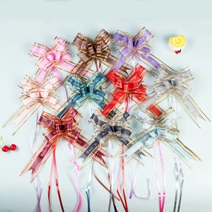 Assorted colorful ribbon bows with gold edges and Best Wishes text for party decoration
