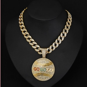 Hip hop gold Cuban chain necklace with iced out GO GO GO round pendant on black bust display