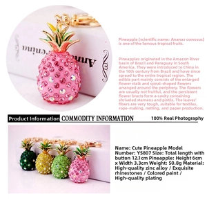 Detail view of sparkling crystal pineapple keychain charms in various vibrant colors