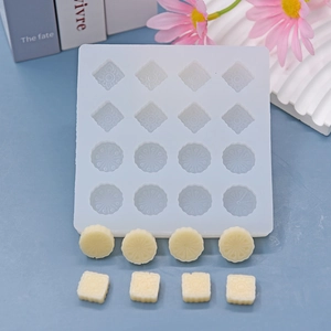 16-cavity silicone mold with floral diamond and round sunburst patterns for DIY crafts