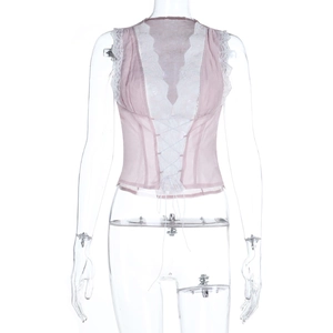 Detail of pink chiffon vest featuring deep V-neck, lace patchwork, and front tie closure