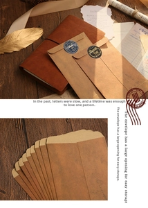 Macro detail of kraft paper envelopes with Thank You seal stickers in a vintage setting