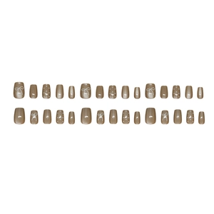 Gentle light coffee press-on nails with bow, polka dots, and glitter cat-eye finish
