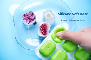 Detail showing the flexible silicone bottom for easy ice cube release from the green tray