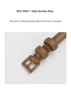Detail view of premium alloy buckle and stitched brown leather strap on women belt