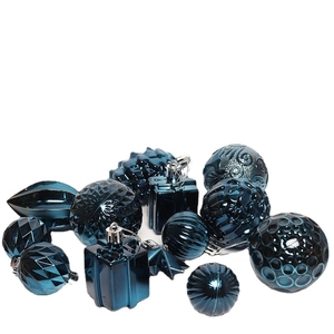 Deep blue assorted Christmas ornaments with textured finishes on white background