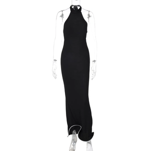 Close-up of black backless maxi dress with halter neck and white contrast trim hem