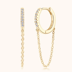 Detail view of gold S925 sterling silver hoop earrings with shimmering chain tassels