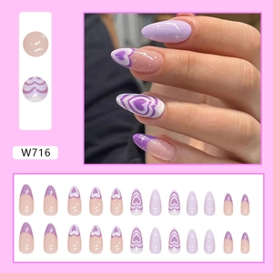 Purple almond press-on nails with heart designs and stars in a 24-piece full set