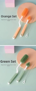 Detailed set of silicone baby bottle brushes in orange and green with straw cleaners