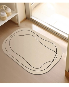 Macro shot of beige diatomaceous earth bath mat with minimalist black line design