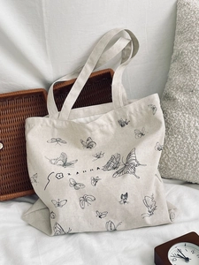Minimalist canvas tote bag with black butterfly print and Zakka lettering for women