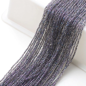 Detailed view of faceted grey-purple glass beads for DIY jewelry making and crafts