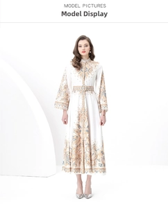 Detail of elegant lace cuffs and intricate vintage floral print on a long sleeve dress