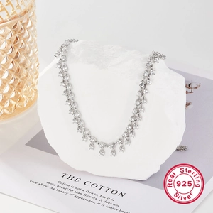 Elegant 925 sterling silver necklace with sparkling zircon fringe beads on artistic stone