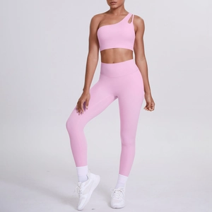 Detail of pink one-shoulder yoga bra and high-waist seamless leggings fitness set