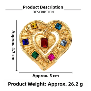 Macro detail of a heart-shaped brooch with colorful crystals and dimensions 5cm x 4.7cm