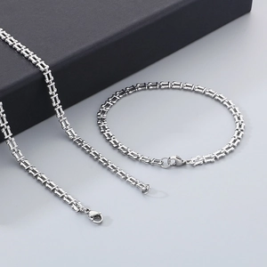 Modern silver stainless steel musical note necklace and bracelet set with geometric links