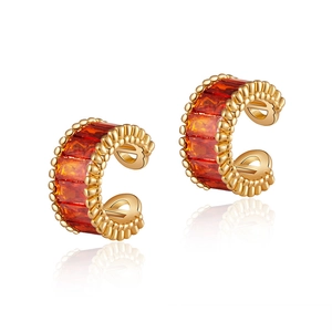 Detail of 18K gold plated C-shaped ear cuff with orange rectangular zircon stones