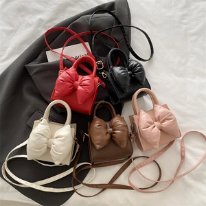 Fashionable bow-knot women handbag in five colors with PU leather and shoulder strap