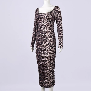 Detailed view of long sleeve leopard print dress with ruched bodycon design and square neck
