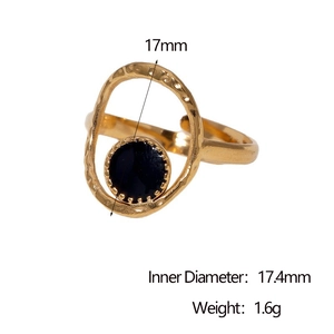 Detail view of gold stainless steel ring with black round stone and size measurements
