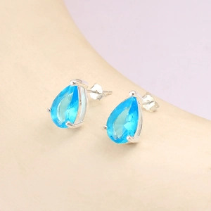 Macro view of S925 silver stud earring showing the teardrop blue zircon and S925 hallmark