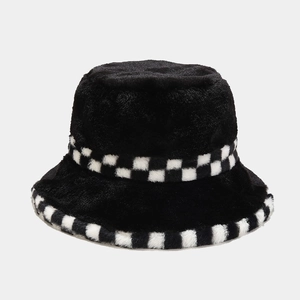 Detail of black plush bucket hat featuring checkerboard trim and warm fuzzy texture