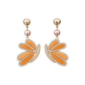 Vintage golden wing jewelry set with pearls and rhinestones on a clean white background