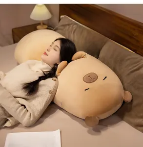 Close-up of soft plush capybara body pillow featuring cozy embroidered facial details