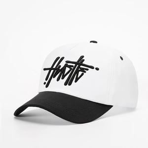 Adjustable black and white baseball cap with 3D Hustle embroidery on cotton fabric