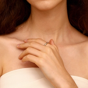 Detail shot of a wavy 18K gold plated stainless steel ring with full crystal pavé