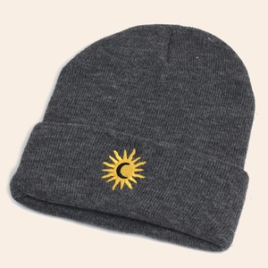 Thick dark gray knitted beanie featuring a sun embroidery for winter warmth and fashion