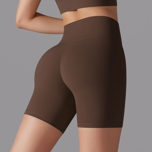 Detailed view of high-waisted seamless dark brown yoga shorts with butt-lifting stitching
