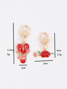 Detail showing red heart balloon and lip charms with dimensions for keychains