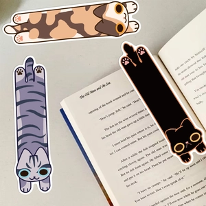Detailed view of cute cartoon cat bookmarks set in different breeds on book pages