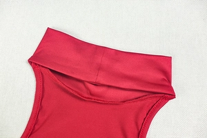 Detail of high stand collar on red sleeveless dress showing fine stitching and silky texture