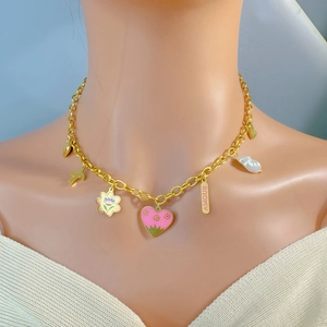 Golden chunky chain necklace featuring colorful enamel heart, flower and pearl pendants