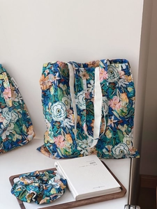 Detail of floral cotton tote bag with matching hair scrunchie and simple wish label