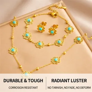 Detail of flower-shaped jewelry set with turquoise beads and gold-plated chains